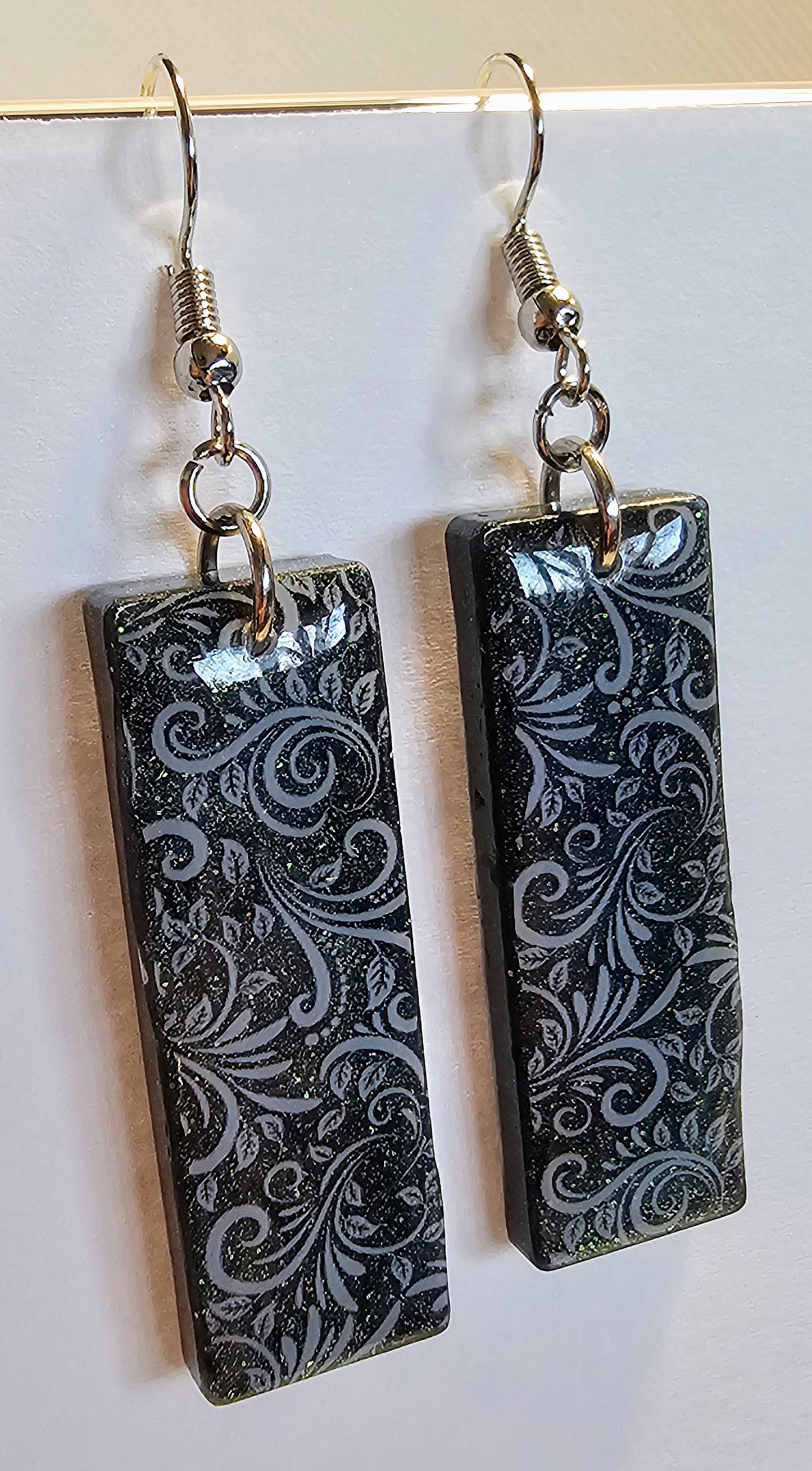 Dark floral patterned earrings