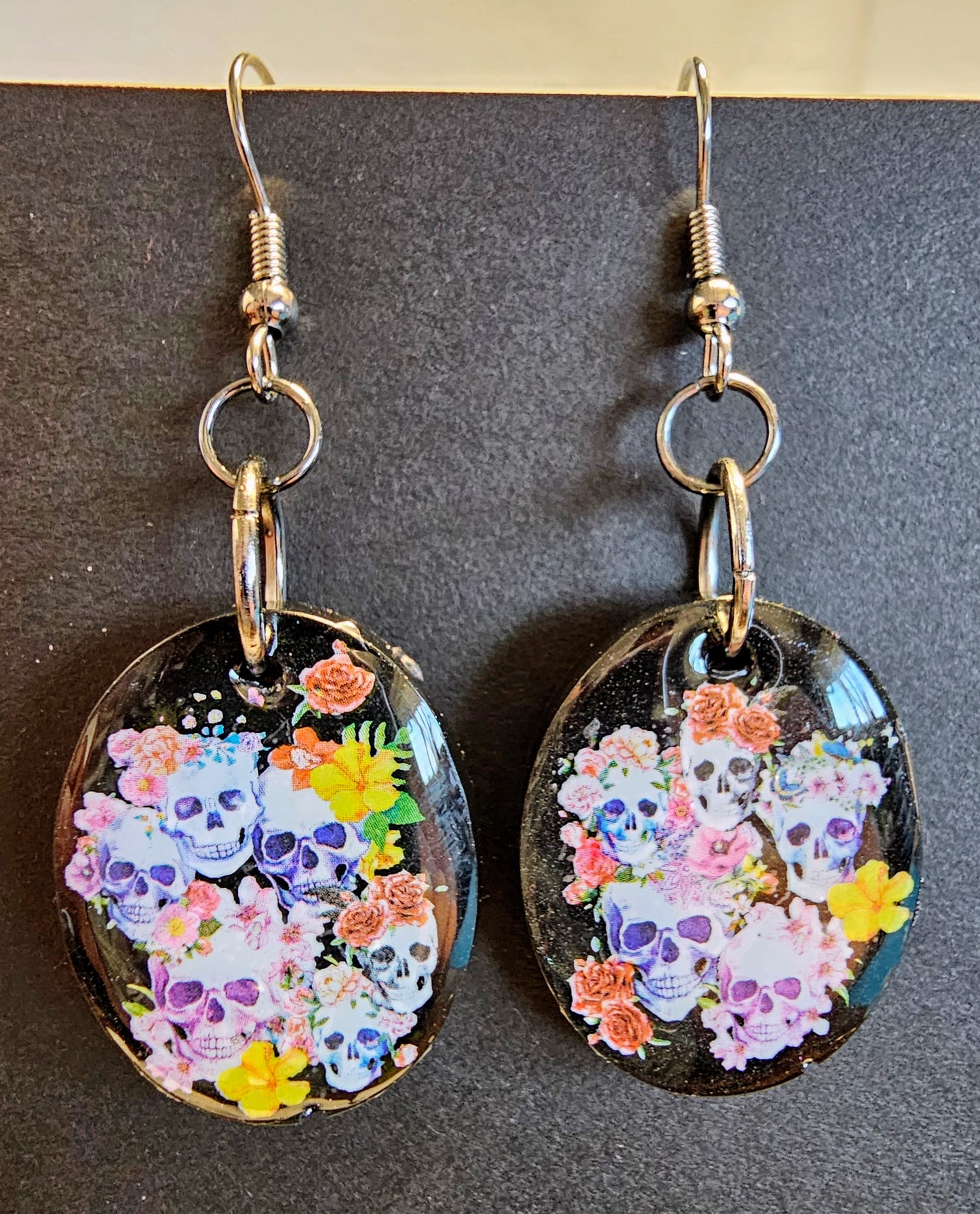 Flower skull earrings with iridescent glitter backs