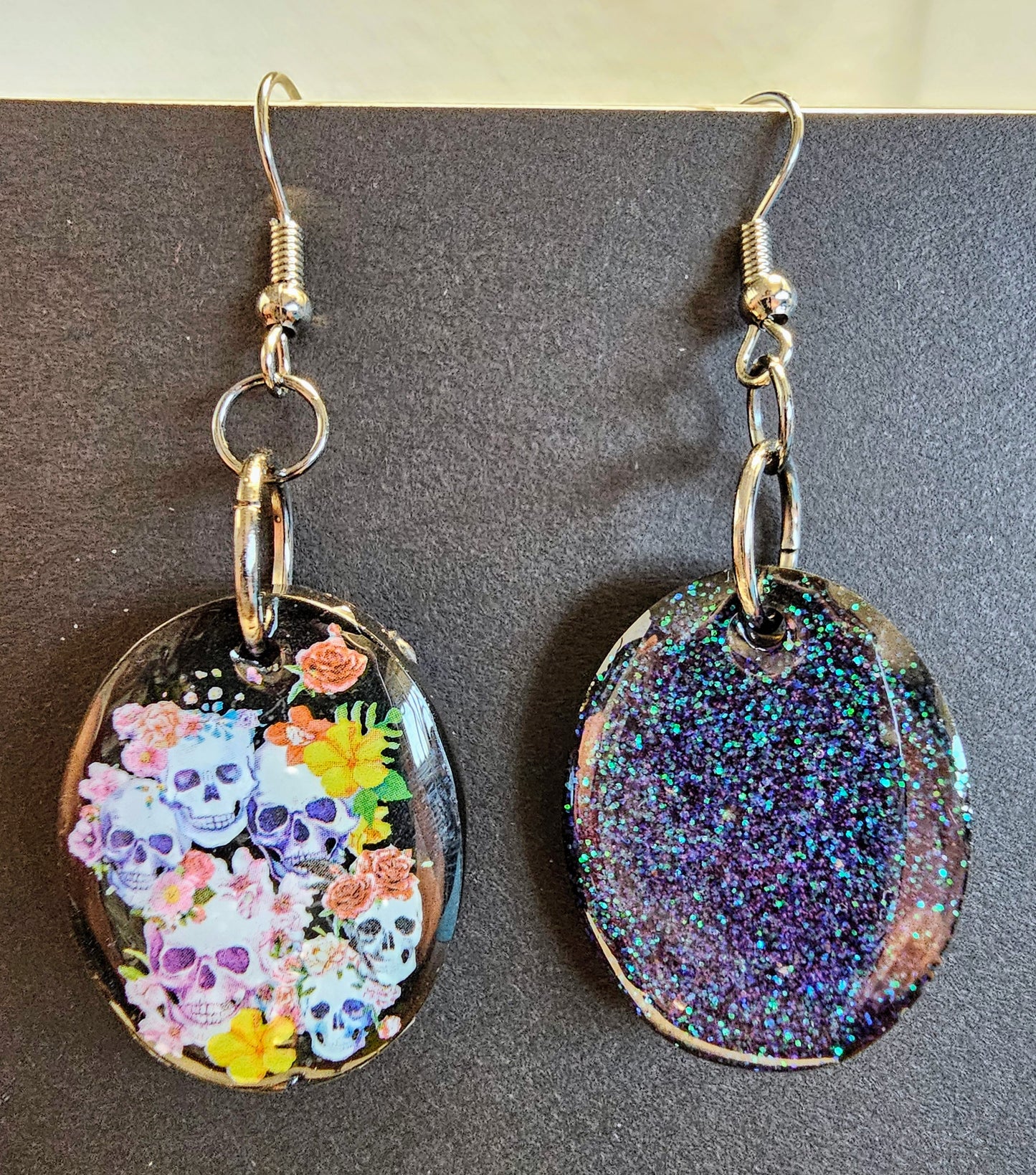 Flower skull earrings with iridescent glitter backs
