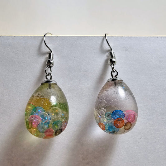 Egg-shaped earrings with multicolored glass bubbles imbedded